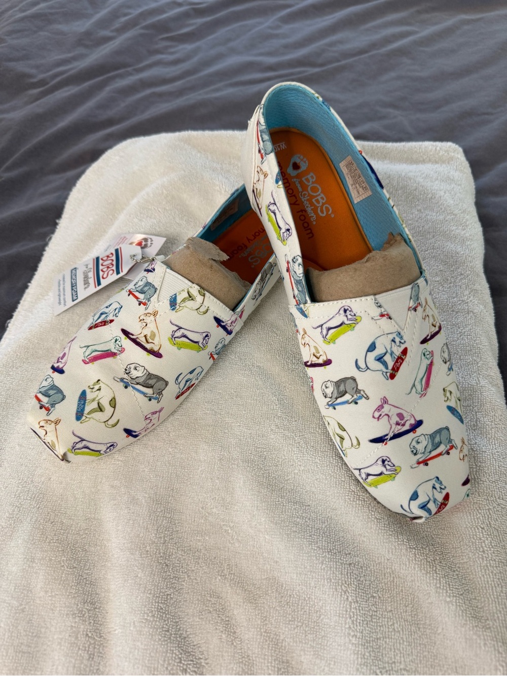 🧩 BOBS from Skechers White Canvas Slip-Ons with Multicolor Dog Skate Print